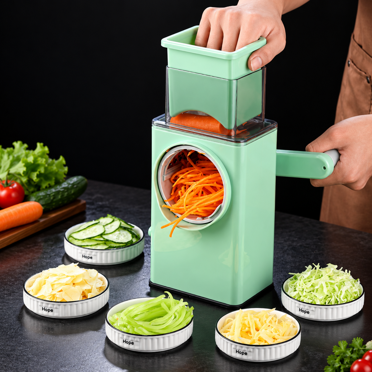 Nexora PrepMate mint-green manual rotary vegetable chopper preparing shredded carrot with interchangeable blade dishes
